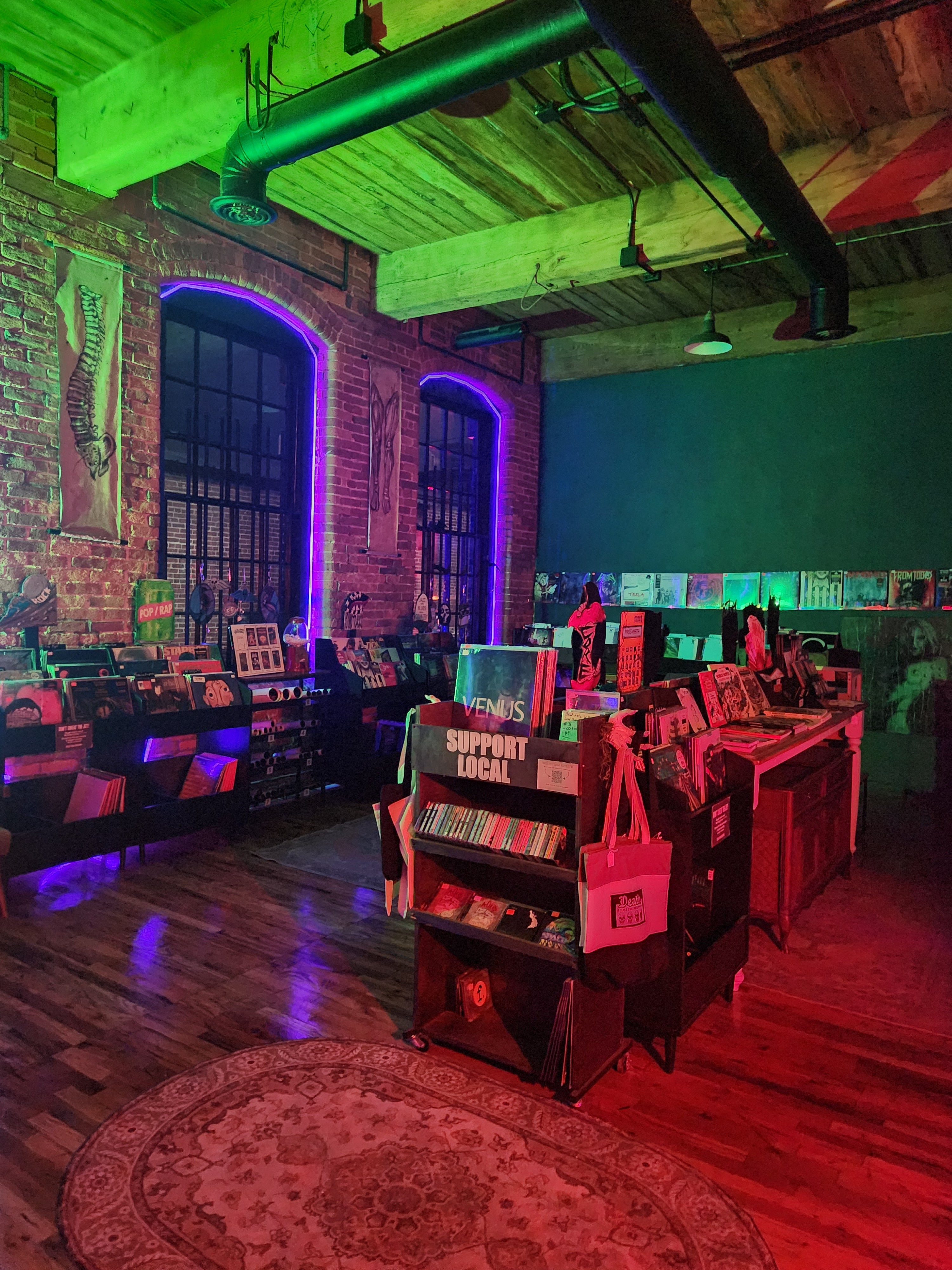 Colorful interior with books stacked on a shelf and a door in the background