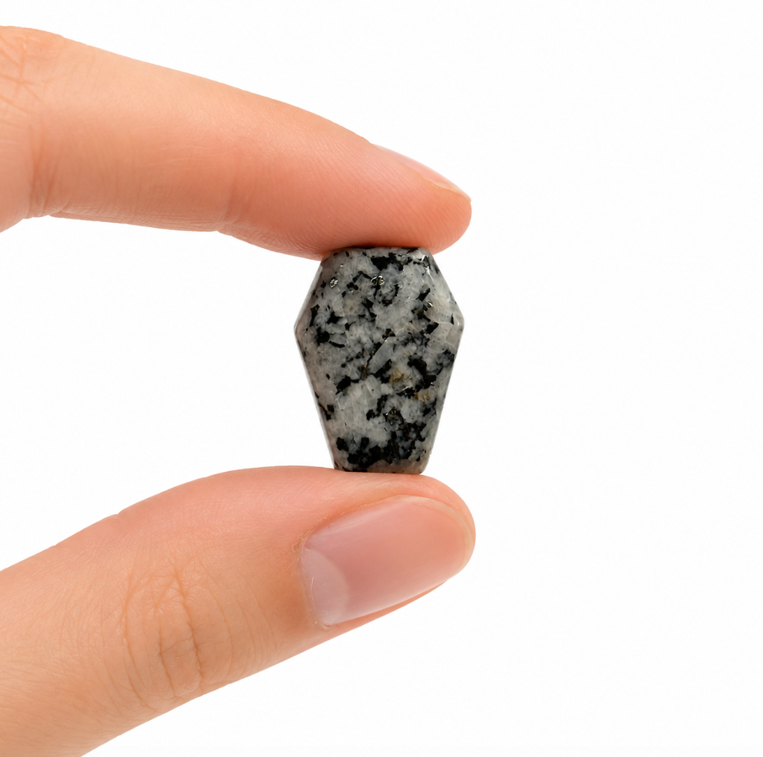 Mini coffin-shaped gemstone, polished with natural color variation